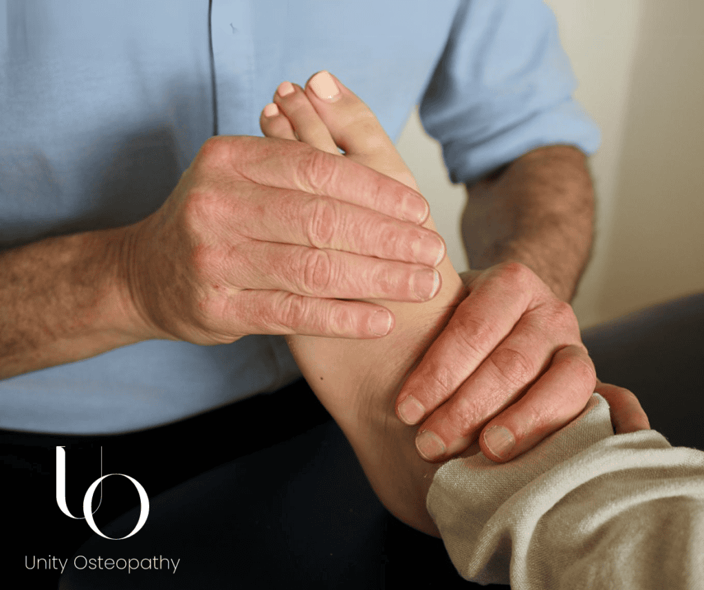 Matthew Stewart, Registered osteopath at Unity Osteopathy, Parnell Auckland using foot manipulation techniques to treat plantar fasciitis. 